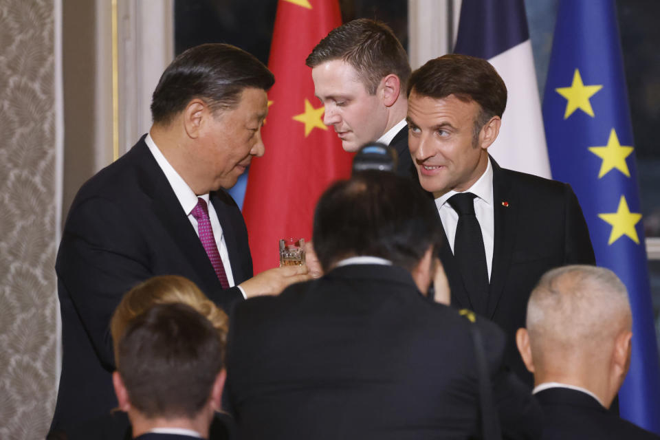 French President Emmanuel Macron, right, toasts with Chinese President Xi Jinping during a a state dinner at the Elysee Palace in Paris, Monday, May 6, 2024. French President Emmanuel Macron put trade disputes and Ukraine-related diplomatic efforts on top of the agenda for talks with Chinese President Xi Jinping, who arrived in France for a two-day state visit opening his European tour. (Ludovic Marin, Pool via AP)