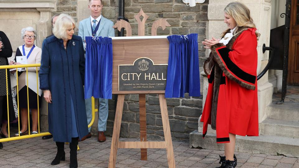Queen Camilla unveiling a plaque