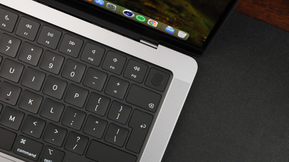 Close up of the finger print reader of an Apple MacBook Pro sitting on a desk