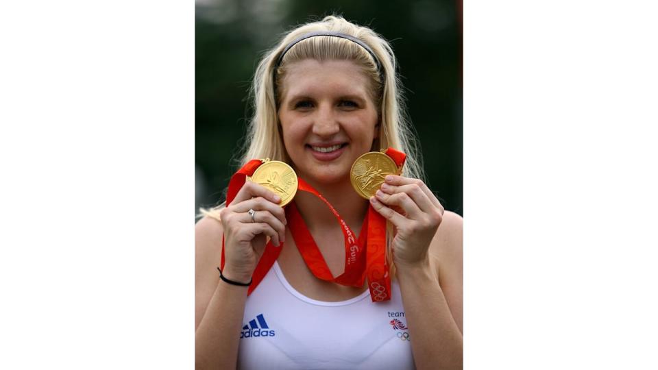 Rebecca Adlington of Great Britain holds up her two Olympic swimming gold medals outside the Athletes Village during Day 8 of the Beijing 2008 Olympic Games on August 16, 2008 in Beijing, China