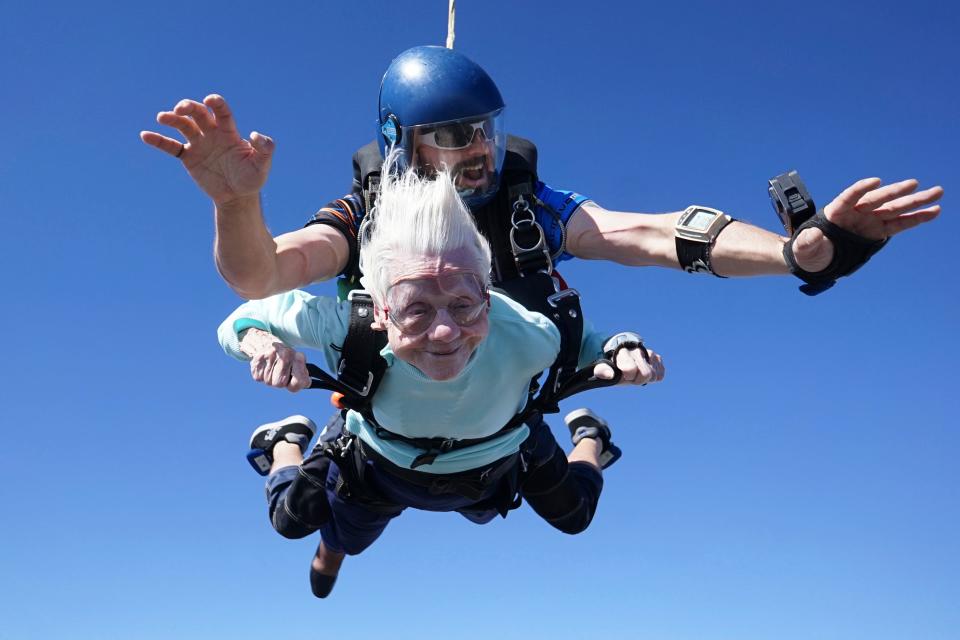 This photo provided by Daniel Wilsey shows Dorothy Hoffner, 104, falling through the air with tandem jumper Derek Baxter as she becomes the oldest person in the world to skydive, Sunday, Oct. 1, 2023, at Skydive Chicago in Ottawa, Ill.