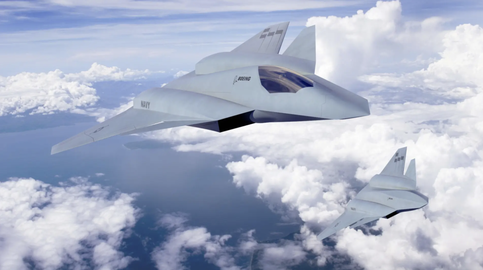 An artist’s conception of a sixth-generation stealth combat jet for the U.S. Navy, as well as an advanced companion drone design. <em>Boeing</em>