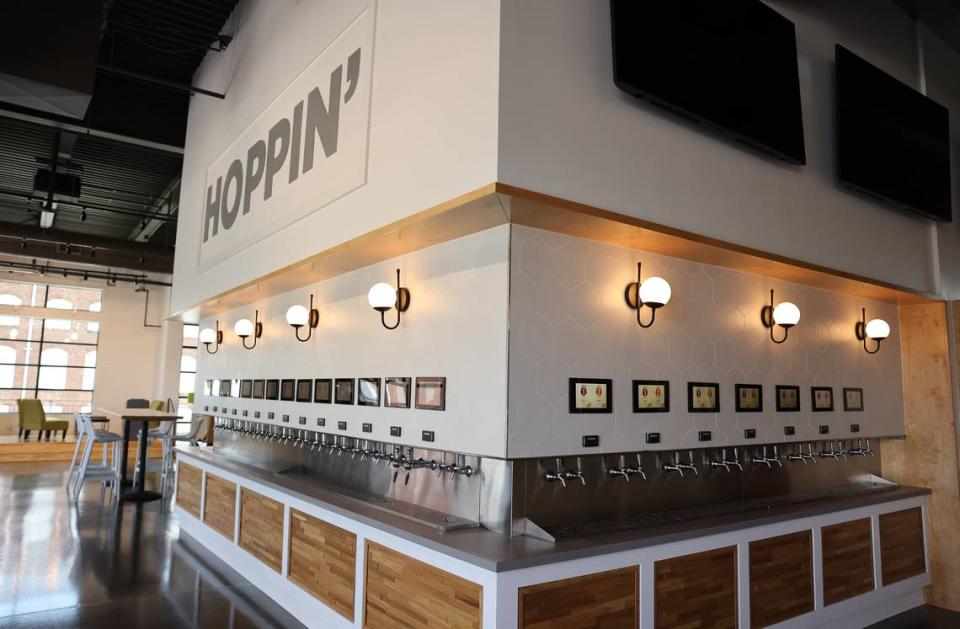 Hoppin’ Rock Hill is a self-pour taphouse with beer garden, located in an historic cotton warehouse in downtown Rock Hill. Tracy Kimball