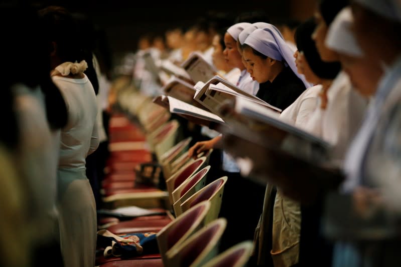 Students practice choral singing in a church, ahead of Pope Francis' visit to Thailand, in Bangkok