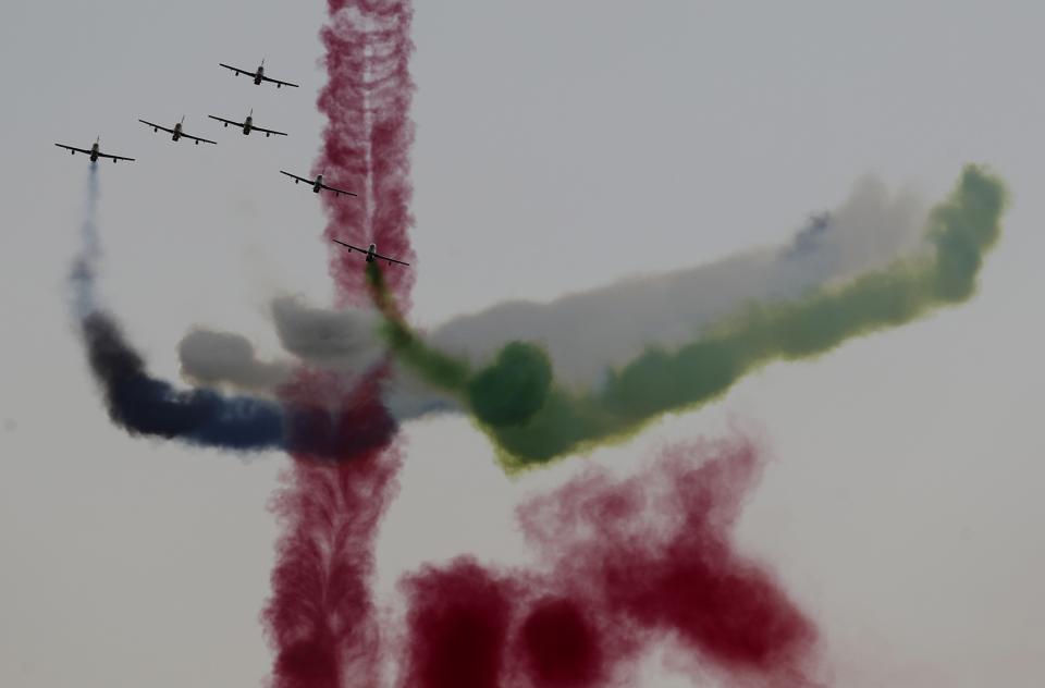 Al Fursan, or the Knights, a UAE Air Force aerobatic display team, perform during the opening day of the International Defence Exhibition & Conference, IDEX, in Abu Dhabi, United Arab Emirates, Sunday, Feb. 21, 2021. (AP Photo/Kamran Jebreili)