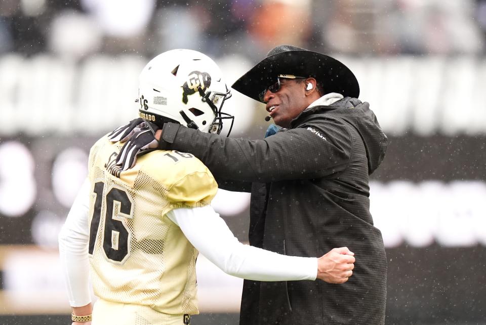 April 27, 2024; Boulder, CO, USA; Colorado Buffaloes coach Deion Sanders talks with quarterback Ryan Staub (16) during a spring game at Folsom Field. Mandatory Credit: Ron Chenoy-USA TODAY Sports