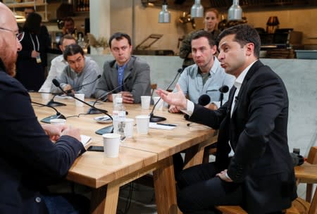 Ukraine's President Volodymyr Zelenskiy holds a press-marathon at a food market in Kiev