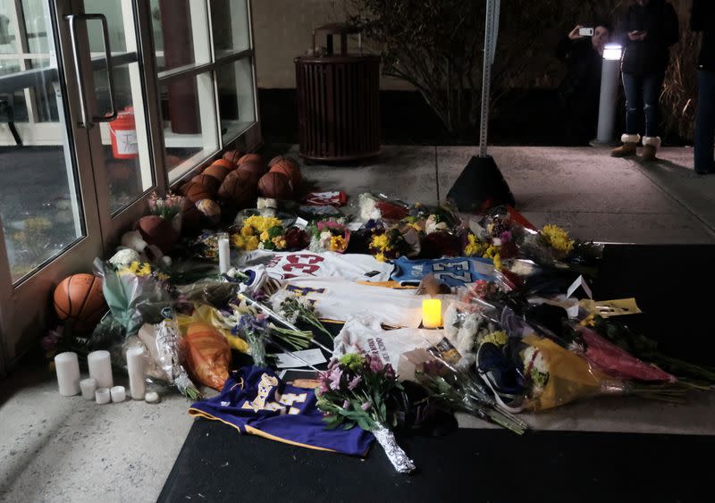 Mourners gather outside of Bryant Gymnasium