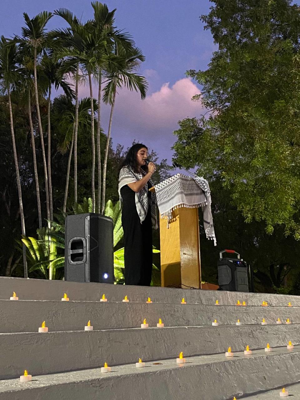 University of Miami senior Mona Abuzahra, who grew up in the West Bank, speaks at the candlelight vigil on Oct. 23 at UM’s Coral Gables campus to honor those who died since the Oct. 7 Hamas attack on Israel and the subsequent Israeli bombings in Gaza. “We talked about the Israeli lives that were lost, and the Palestinian lives that were lost,” she said.