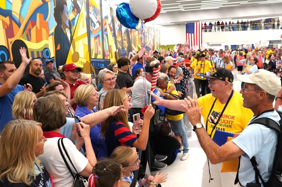 After the veteran's return to the Cincinnati/Northern Kentucky Airport, they are greeted by a massive crowd that includes veteran's groups, their families and many former participants in the honor flight. At nearly 10 p.m. on a Wednesday night, about 2,000 people packed the lobby as the veterans came back home.