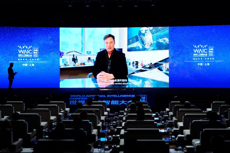 FILE PHOTO: Tesla Inc CEO Elon Musk is seen on a screen during the opening ceremony of the WAIC in Shanghai