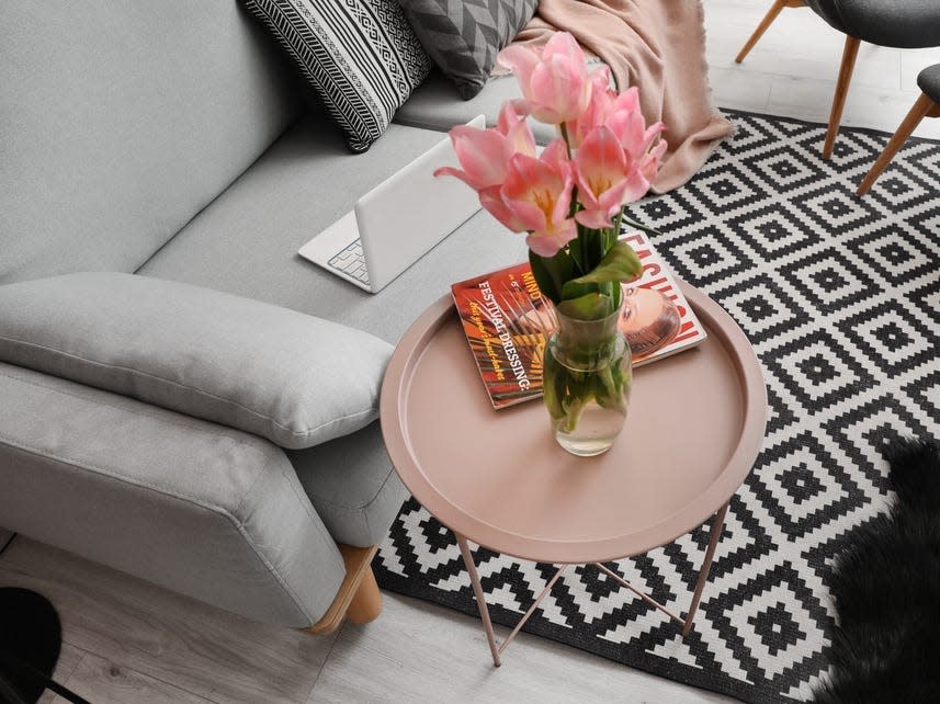 fresh flowers on pink side table