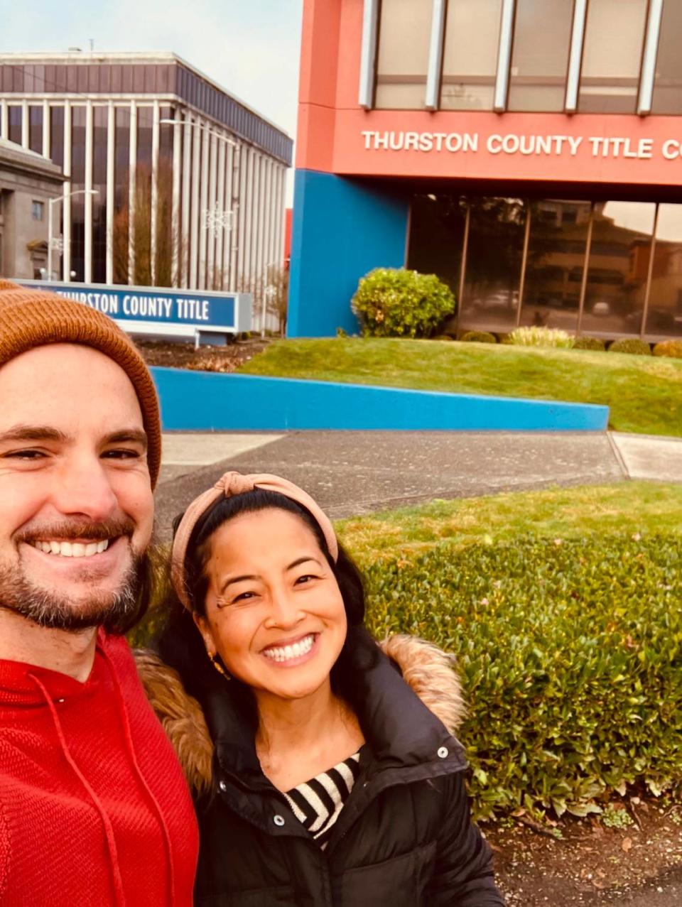 True Self Yoga owners Christina Lagdameo and Vajra Romano pose outside Thurston County Title after acquiring a nearby building to expand their west Olympia business.