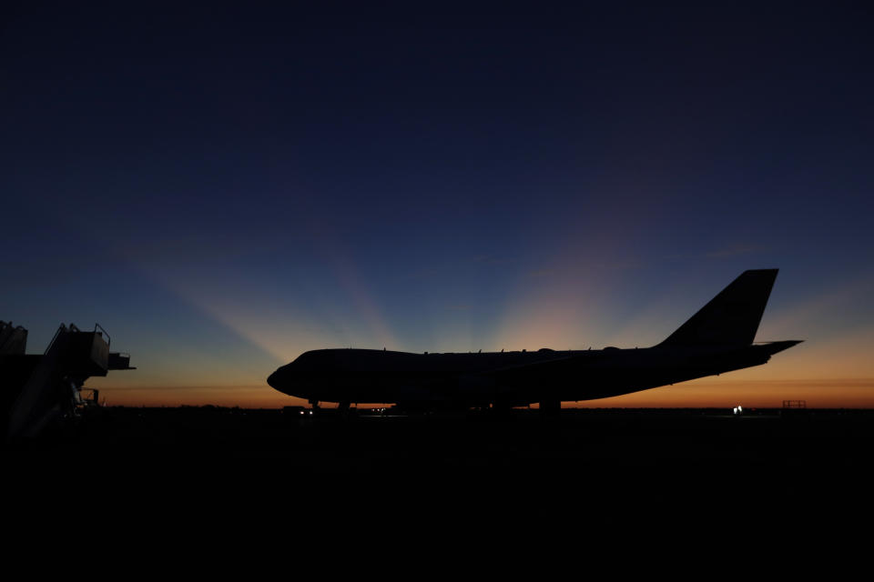 The sun rises behind Special Air Mission 41, the plane that will transfer the casket of former President George H.W. Bush to Washington,D.C., Monday, Dec. 3, 2018, in Houston. (Photo: Eric Gay/AP)