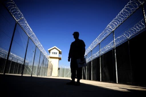 A US military policeman patrols Afghanistan's notorious Bagram prison in 2009. The United States on Friday signed a deal transferring control of the Bagram prison to the Afghan government, marking a breakthrough in negotiations on a strategic treaty between the two nations