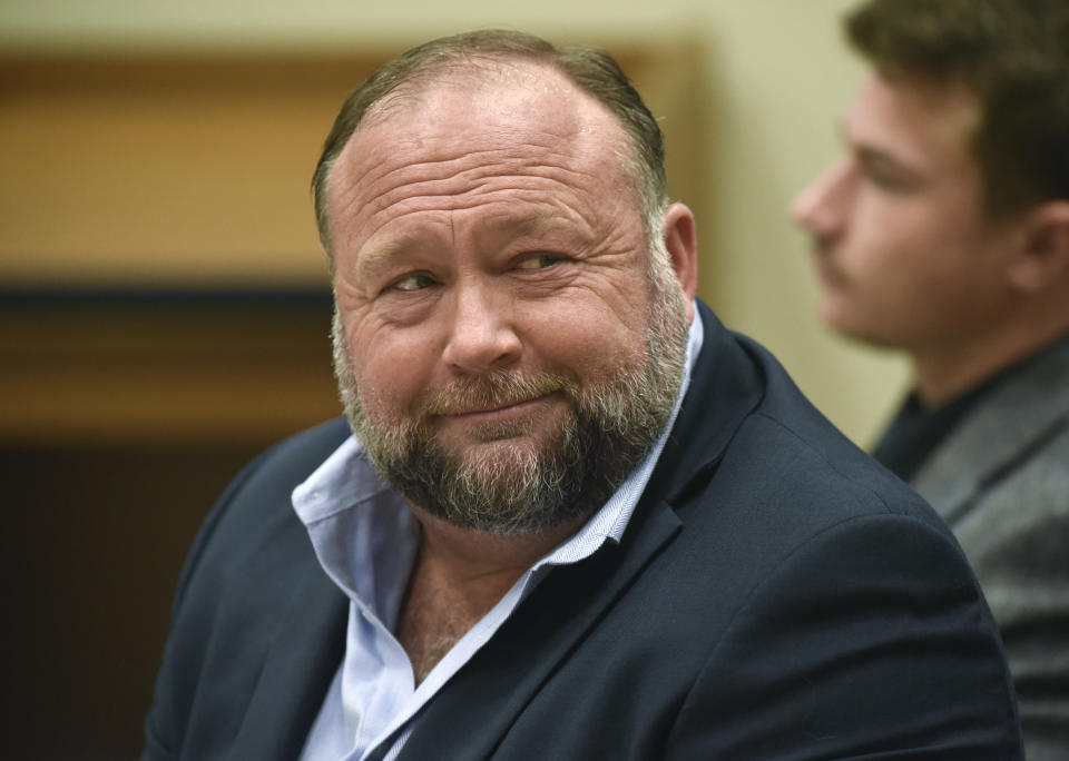 FILE - Infowars founder Alex Jones appears in court to testify during the Sandy Hook defamation damages trial at Connecticut Superior Court in Waterbury, Conn., on Sept. 22, 2022. A federal bankruptcy judge on Monday, Dec. 19, allowed cases to move forward regarding the nearly $1.5 billion Jones has been ordered to pay to families who sued him over his conspiracy theories about the Sandy Hook school massacre. (Tyler Sizemore/Hearst Connecticut Media via AP, Pool, File)