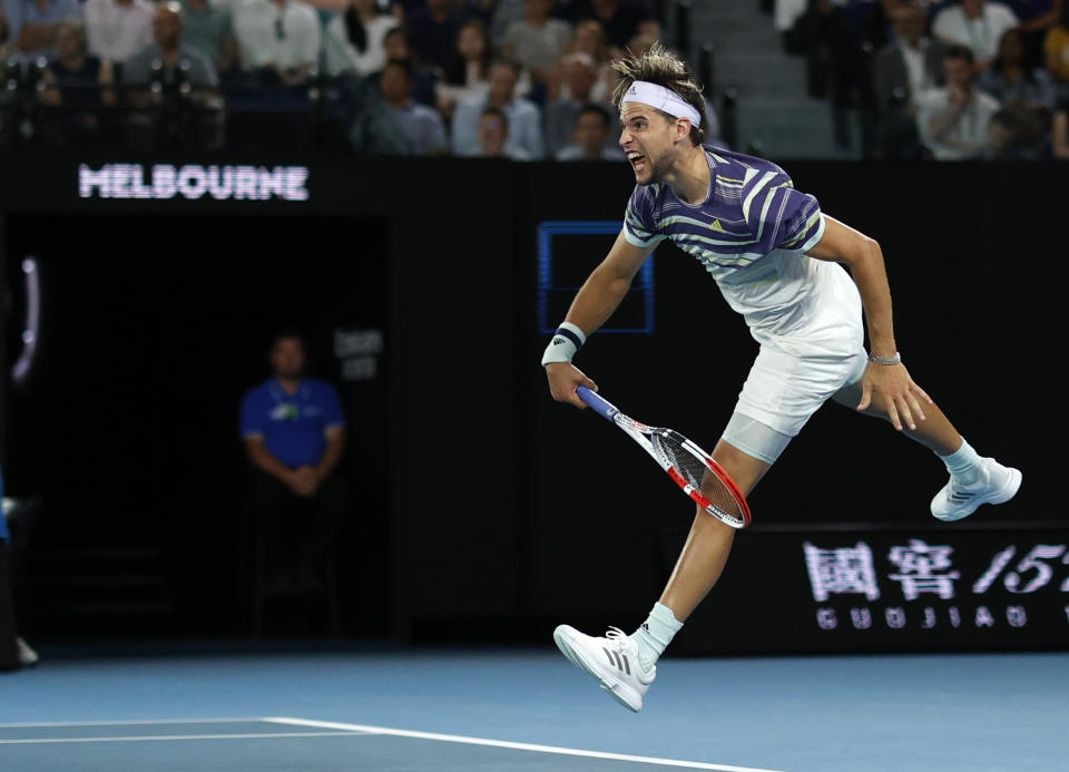 Austria's Dominic Thiem serves to Spain's Rafael Nadal during their quarterfinal match at the Australian Open tennis championship in Melbourne, Australia, Wednesday, Jan. 29, 2020. (AP Photo/Andy Wong)