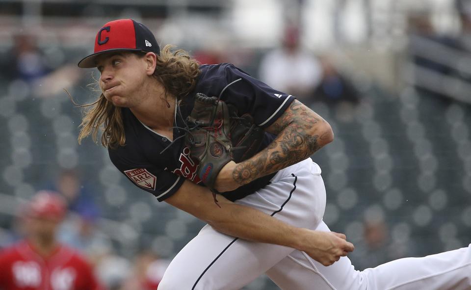 Cleveland Indians pitcher Mike Clevinger throws a pitch during the fourth inning of a spring training baseball game against the Cincinnati Reds Monday, March 11, 2019, in Goodyear, Ariz. (AP Photo/Ross D. Franklin)