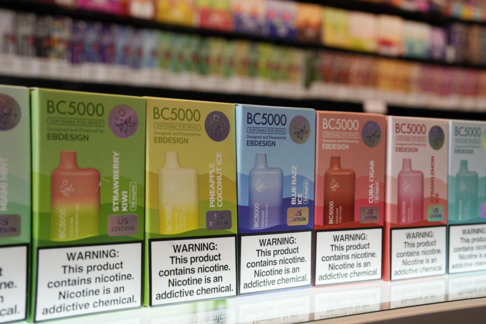 A few of the varieties of disposable flavored electronic cigarette devices manufactured by EB Design, formerly known as Elf Bar, are displayed at Vapes N Smoke in Pinecrest, Fla., Monday, June 26, 2023. Since 2020, the number of different e-cigarette devices for sale in the U.S. has exploded to more than 9,000, a nearly three-fold increase driven almost entirely by a wave of disposable vapes from China. (AP Photo/Rebecca Blackwell)