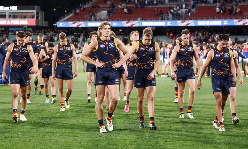 <span>Adelaide Crows players trudge off after losing to Melbourne at Adelaide Oval on Thursday night – their fourth straight defeat.</span><span>Photograph: Michael Willson/AFL Photos/Getty Images</span>