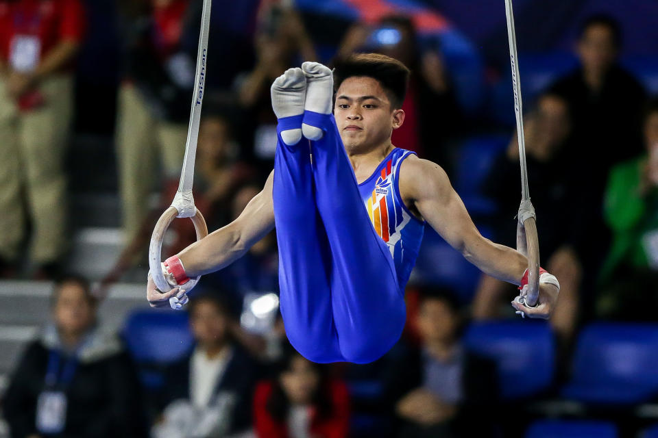 MANILA, Dec. 3, 2019 -- Carlos Edriel Yulo of the Philippines competes during the final match of the men's gymnastic artistic still rings at the Southeast Asian Games 2019 in Manila, the Philippines, Dec. 3, 2019. (Photo by Rouelle Umali/Xinhua via Getty Images)