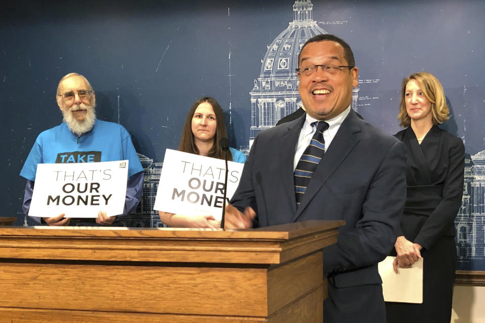 FILE - In this April 23, 2019, file photo, Minnesota Attorney General Keith Ellison speaks at a news conference at the state Capitol in St. Paul, Minn. Taking over as lead prosecutor in George Floyd's death is giving Ellison a national platform to talk about race in America. And while Ellison is careful not to talk about details of the criminal cases against four Minneapolis police officers, he's grabbing the opportunity to raise issues about police reform that he's worked on in the past. (AP Photo/Steve Karnowski File)