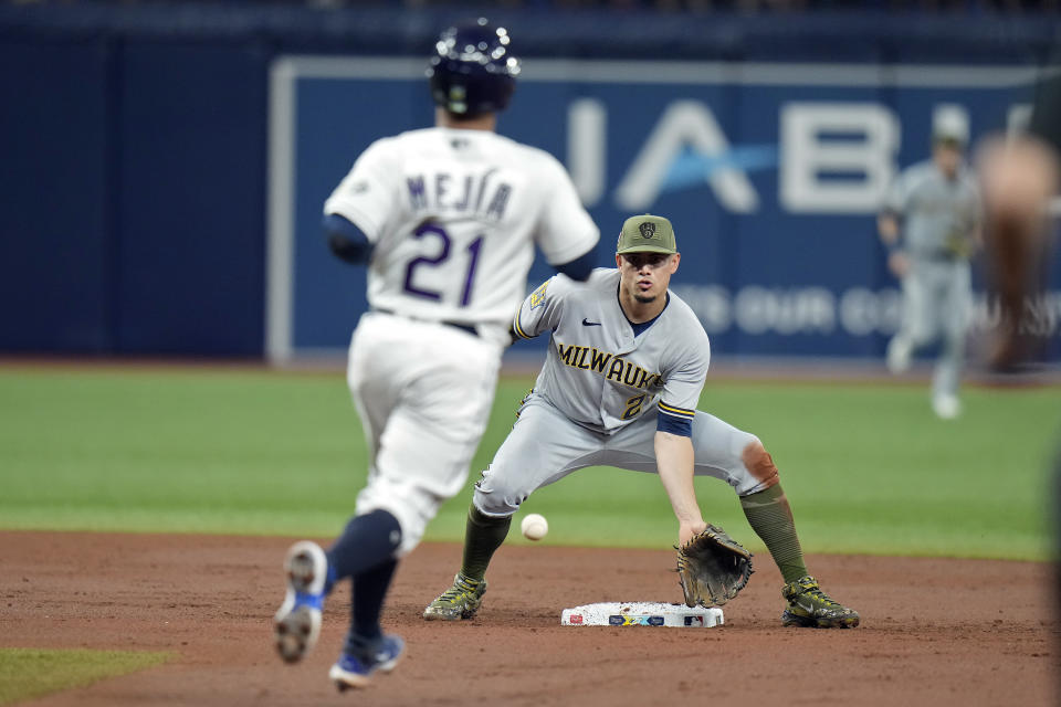 Milwaukee Brewers shortstop Willy Adames forces Tampa Bay Rays' Francisco Mejia (21) at second base on a fielder's choice by Josh Lowe during the third inning of a baseball game Friday, May 19, 2023, in St. Petersburg, Fla. (AP Photo/Chris O'Meara)