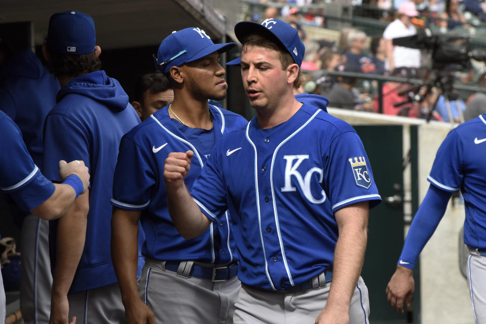 Kansas City Royals starting pitcher Kris Bubic, foreground, is congratulated in the dugout after the final out of the seventh inning of a baseball game against the Detroit Tigers, Sunday, Sept. 26, 2021, in Detroit. (AP Photo/Jose Juarez)