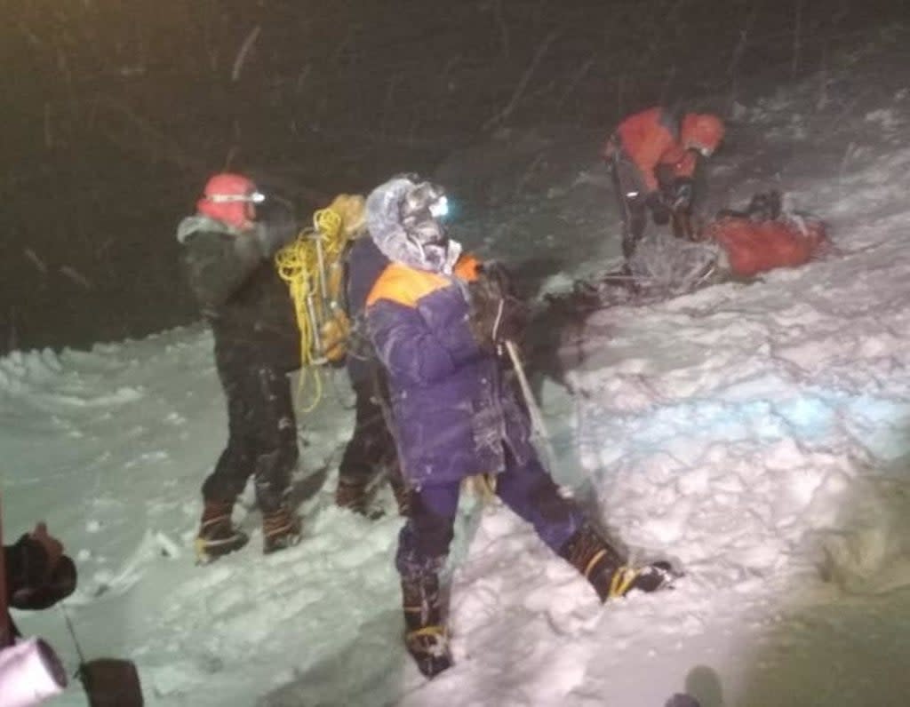 Rescuers on Mount Elbrus after a group of climbers was struck by severe weather conditions while at an altitude of over 16,000ft  (Russian Emergencies Ministry/AFP)