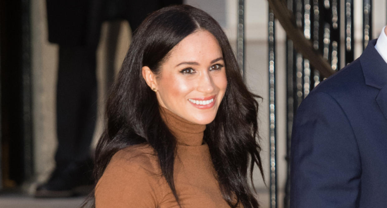 Meghan Markle wearing brown turtleneck and bronzed makeup, i.e. latte trend