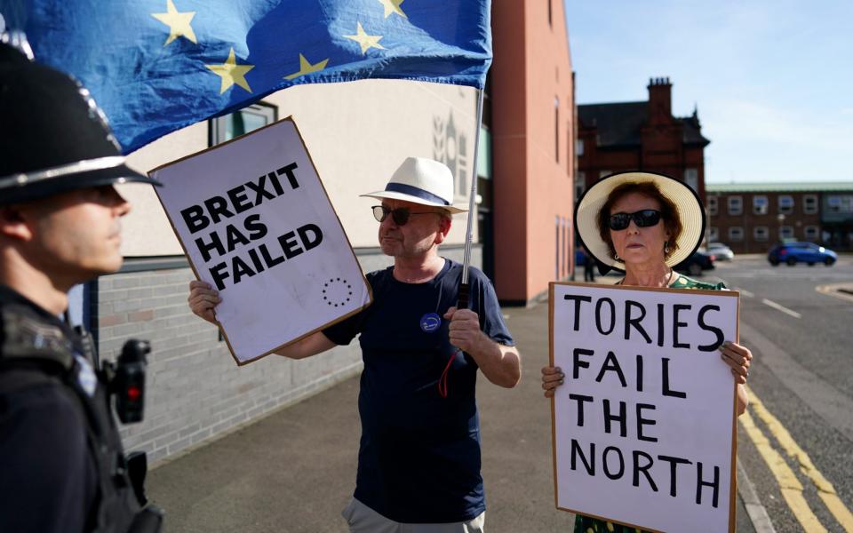 Not everyone is quite so happy to see Mr Sunak or the Foreign Secretary - there are a handful of Brexit and climate protesters outside the venue - Ian Forsyth/Getty Images
