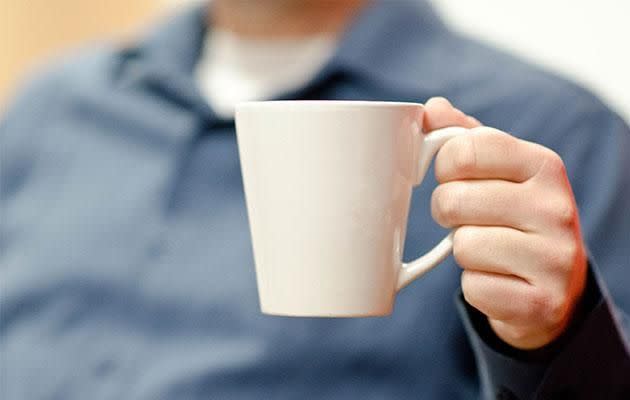 The WRONG way to hold a mug. Photo: Getty Images