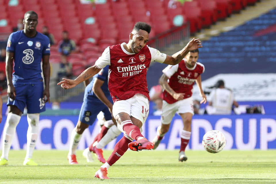 Arsenal's Pierre-Emerick Aubameyang scores his side's first goal from the penalty spot, during the FA Cup final soccer match between Arsenal and Chelsea at Wembley stadium in London, England, Saturday, Aug.1, 2020. (Catherine Ivill/Pool via AP)