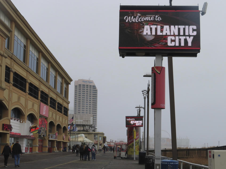 An electronic sign welcomes visitors to the Atlantic City, N.J. Boardwalk on Dec. 28, 2023. Atlantic City faces challenges in the new year including a potential smoking ban in its nine casinos, and their quest to return to pre-pandemic business levels. (AP Photo/Wayne Parry)