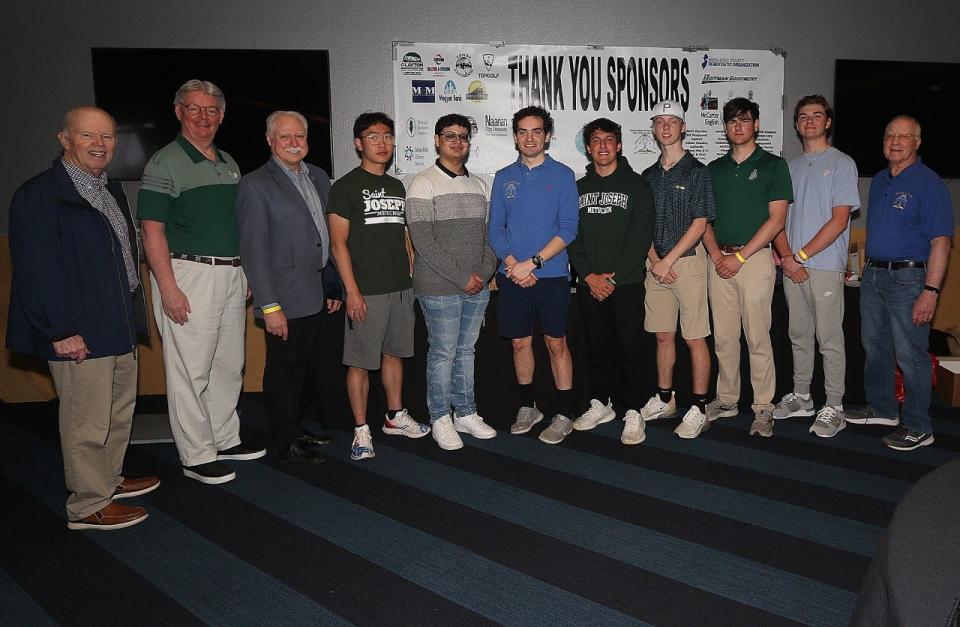 Saint Joseph High School of Metuchen students and President John Nolan Jr. (second from left) pose with Hands of Hope for the Community President Charlie Tomaro (far right), State Senator Patrick Diegnan (far left), and Assemblyman Robert Karabinchak (third from left).