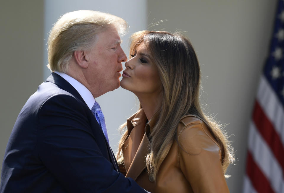 President Donald Trump kisses first lady Melania Trump following an event where Melania Trump announced her initiatives in the Rose Garden of the White House in Washington, Monday, May 7, 2018. (AP Photo/Susan Walsh)