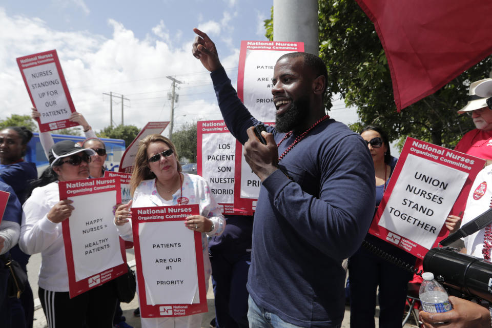 Nucleus Shelton of the AFL-CIO speaks to a group of nurses during a one-day strike outside of Palmetto General Hospital, Friday, Sept. 20, 2019, in Hialeah, Fla. Registered nurses staged a one-day strike against Tenet Health hospitals in Florida, California and Arizona on Friday, demanding higher wages and better working conditions. (AP Photo/Lynne Sladky)