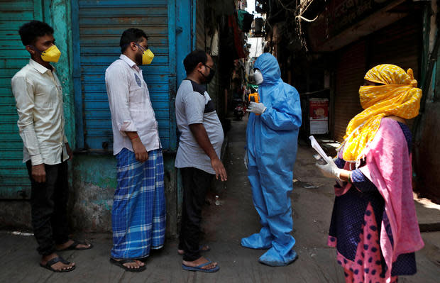 The Wider Image: Indians build their own lockdown barricades in the country's slums 