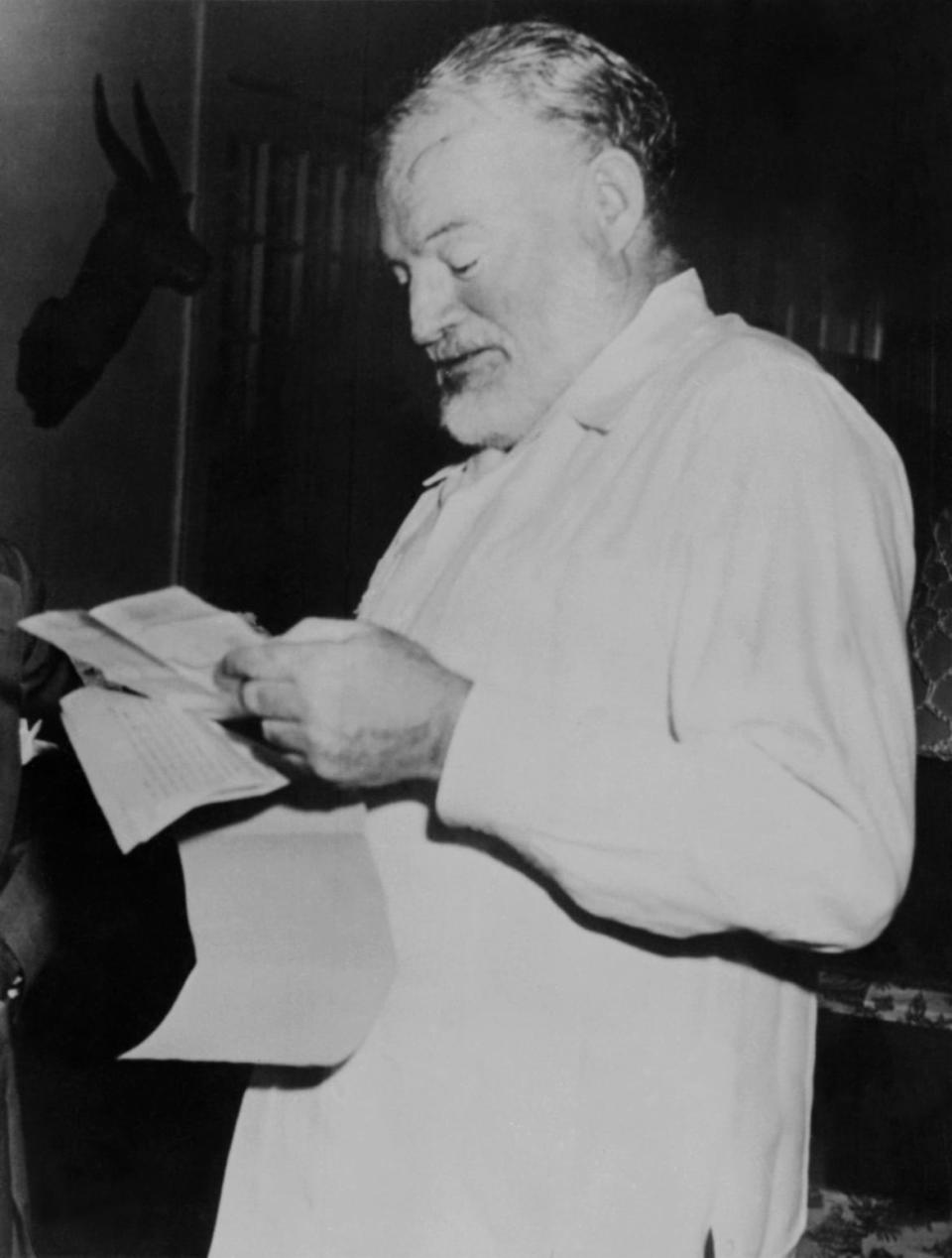 <div class="inline-image__caption"><p>A photo taken in 1952 shows writer Ernest Hemingway reading a letter to learn that he won the Pulitzer Prize for his novel <em>The Old Man and the Sea</em>.</p></div> <div class="inline-image__credit">AFP/Getty</div>