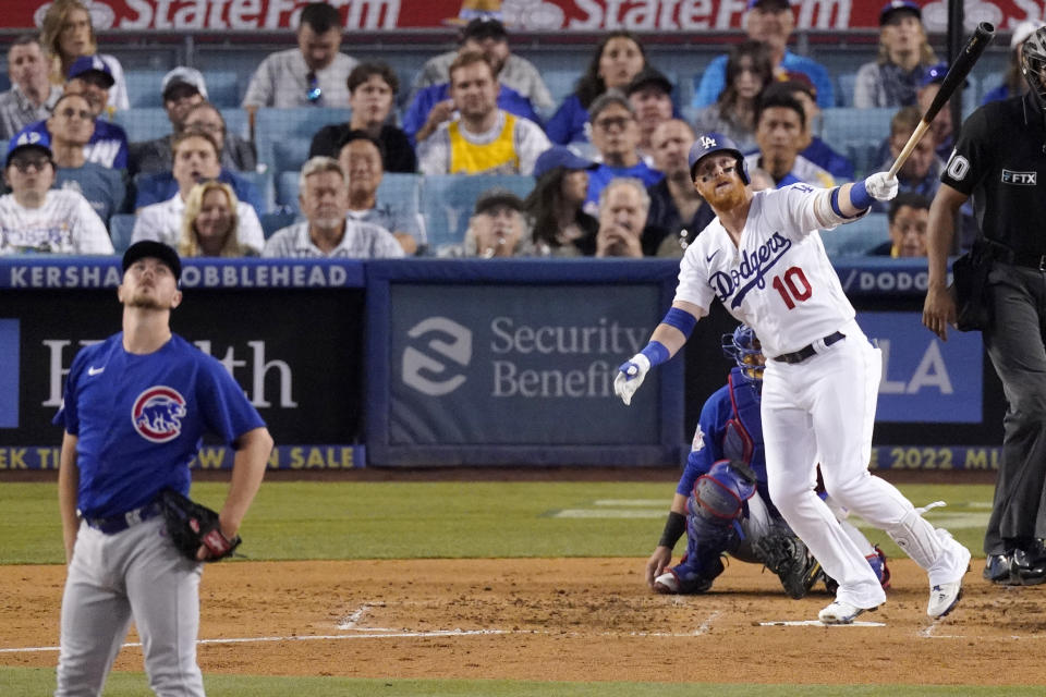 Los Angeles Dodgers' Justin Turner, right, heads to first as he hits a solo home run as Chicago Cubs starting pitcher Mark Leiter Jr. watches during the fourth inning of a baseball game Thursday, July 7, 2022, in Los Angeles. (AP Photo/Mark J. Terrill)