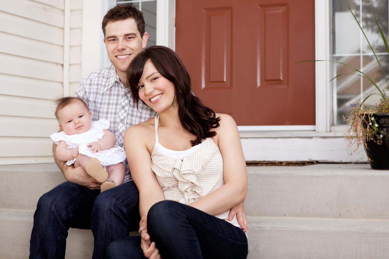 Portrait of a husband and wife with small baby child