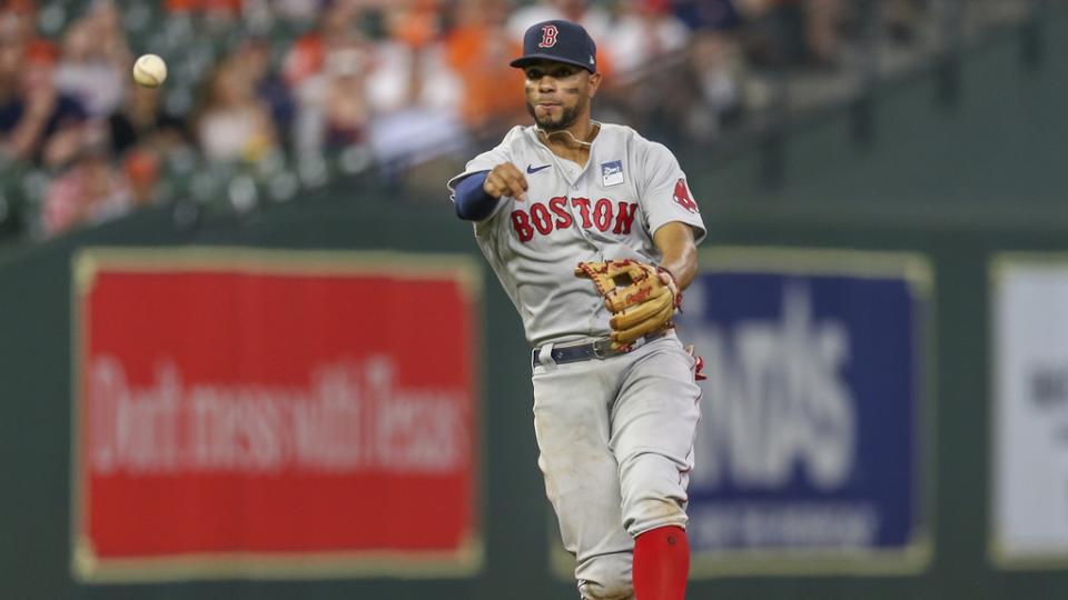 June 2, 2021;  Houston, Texas, USA;  Boston Red Sox shortstop Xander Bogaerts (2) throws out a Houston Astros in the eighth inning at Minute Maid Park.