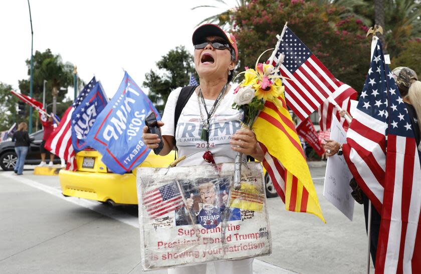 ANAHEIM-CA-SEPTEMBER 29, 2023: Victoria Cooper of Westminster shows her support of former president Donald Trump outside of the California Republican Party Convention at the Anaheim Marriott Hotel on Friday, September 29, 2023. (Christina House / Los Angeles Times)