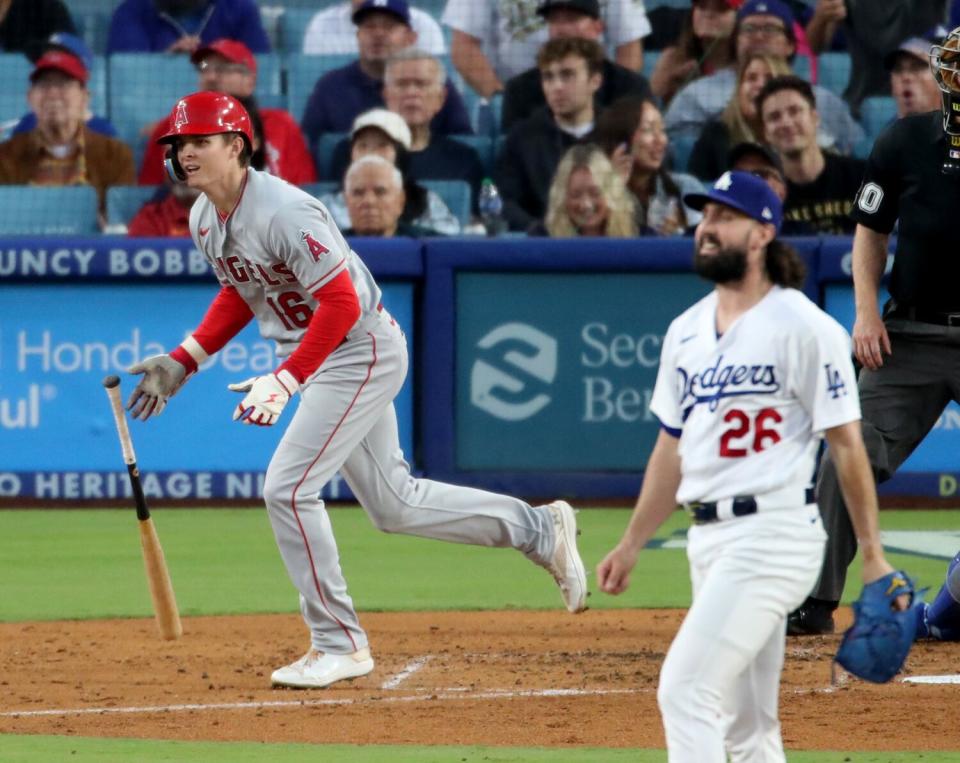 Mickey Moniak, left, hits a three-run home run against Dodgers pitcher Tony Gonsolin at Dodger Stadium on July 7.