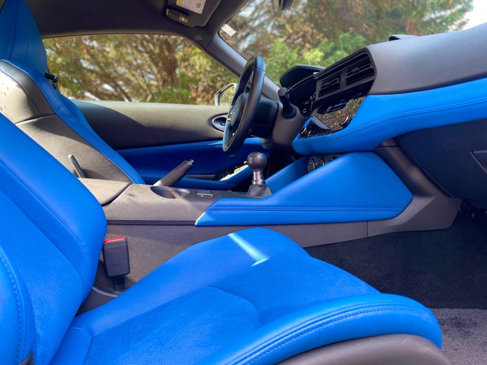 A 2024 Nissan Z Performance sports car's interior with blue leather and synthetic suede.