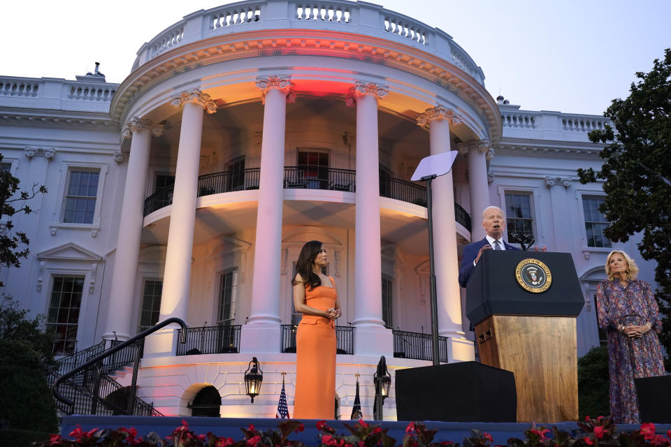 President Joe Biden, with first lady Jill Biden and Eva Longoria, speaks before a screening of the film "Flamin' Hot," Thursday, June 15, 2023, on the South Lawn of the White House in Washington. (AP Photo/Jacquelyn Martin)