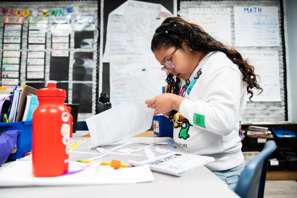 Ashley Soto, a third grader at Cora Kelly School in Alexandria, Va., works on an assignment.