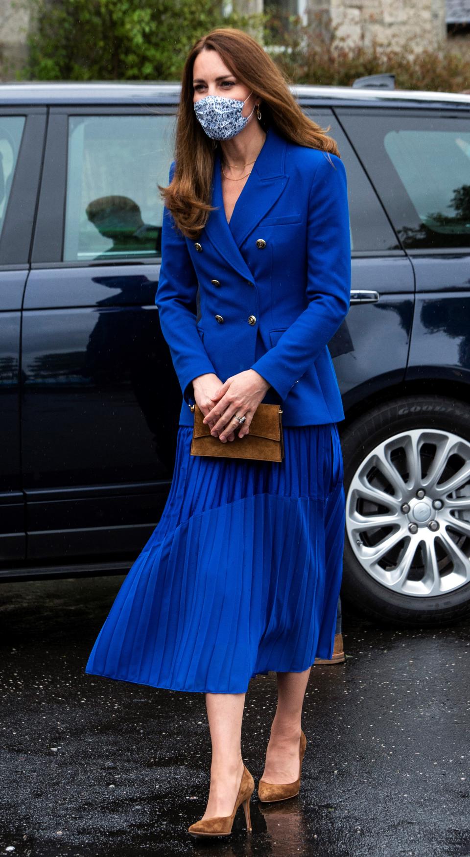 Kate Middleton in a blue jacket and skirt on a visit to Scotland.