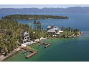 An aerial view of the estate. The Shelter Island home has a boathouse mechanism that allows a water craft to be brought from the lake into moorage under the home without anyone ever having to walk on a dock. <a href="http://yhoo.it/PPVr8r" rel="nofollow noopener" target="_blank" data-ylk="slk:Read more about the estate on Yahoo! Homes' Spaces blog.;elm:context_link;itc:0;sec:content-canvas" class="link ">Read more about the estate on Yahoo! Homes' Spaces blog.</a>