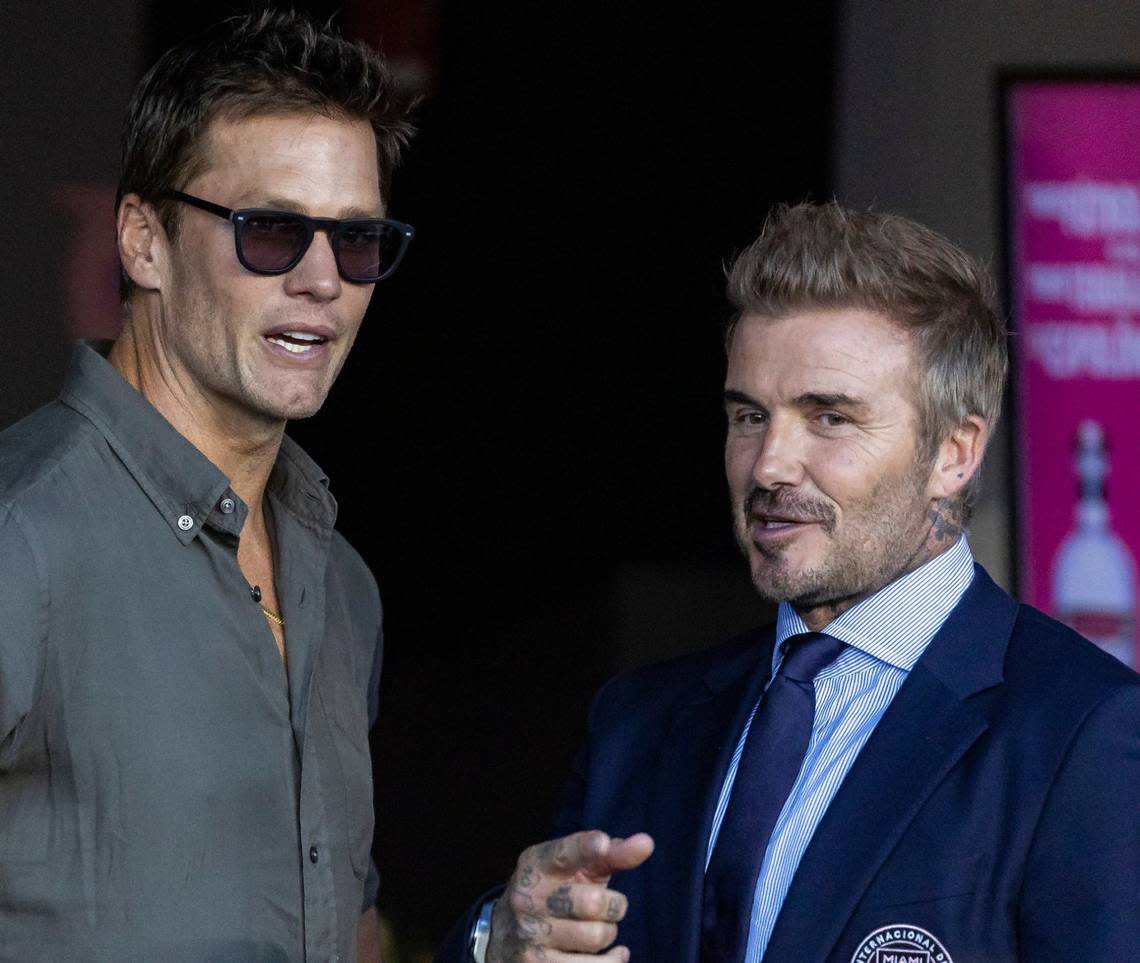 Former NFL football quarterback Tom Brady and Inter Miami co-owner David Beckham talk before an MLS match between Inter Miami and FC Cincinnati at Chase Stadium on Saturday, Aug. 24, 2024, in Fort Lauderdale, Fla.